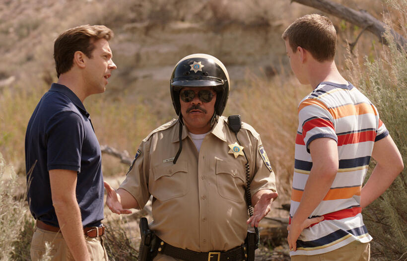 Jason Sudeikis as David Clark, Luis Guzman as Mexican Cop and Will Poulter as Kenny Rossmore in "We're the Millers."