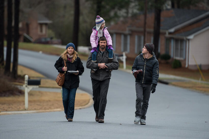 Maria Bello as Grace Dover, Hugh Jackman as Keller Dover, Erin Gerasimovich as Anna Dover and Dylan Minnette as Ralph Dover in "Prisoners."