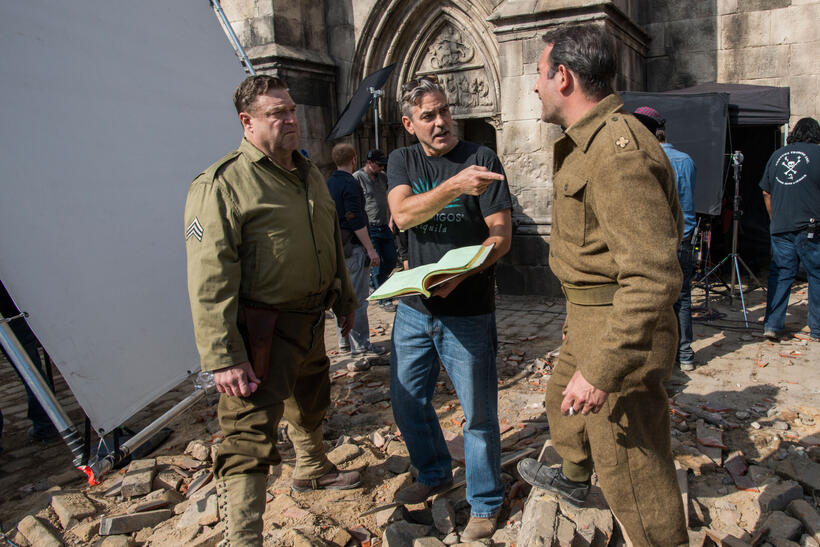 John Goodman, director George Clooney and Jean Dujardin on the set of "The Monuments Men."