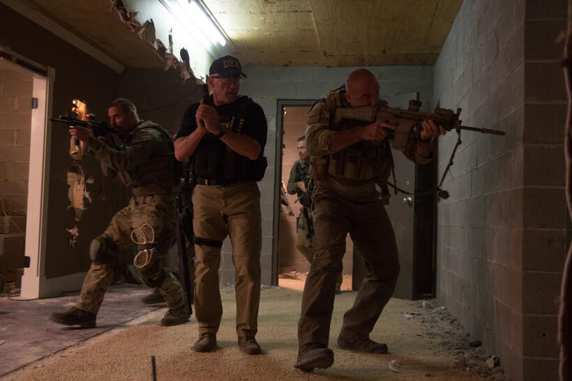 Josh Holloway as Neck, Arnold Schwarzenegger as Breacher, Max Martini as Pyro, and Kevin Vance as Tripod in "Sabotage."