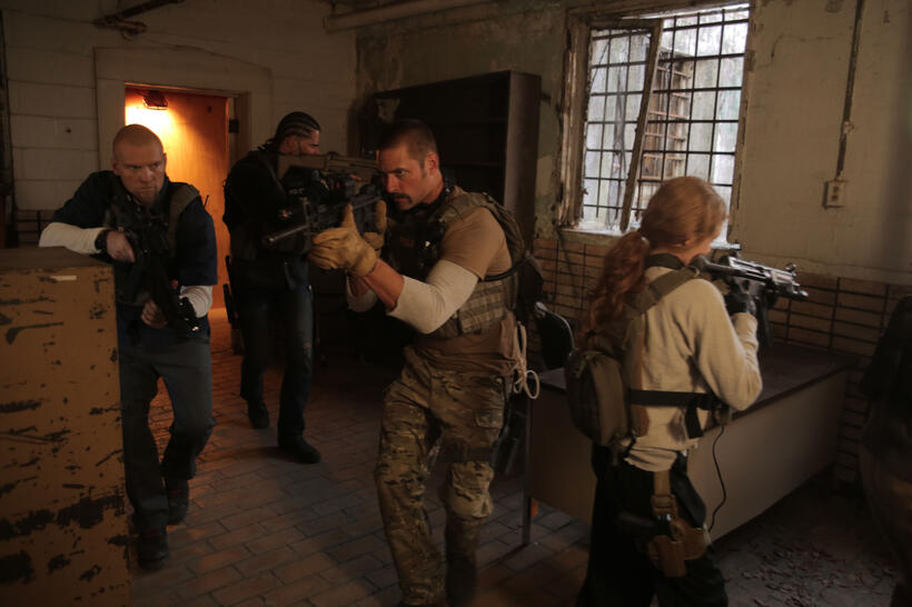 Sam Worthington as Monster, Joe Manganiello as Grinder, Josh Holloway as Neck, and Mireille Enos as Lizzy in "Sabotage."