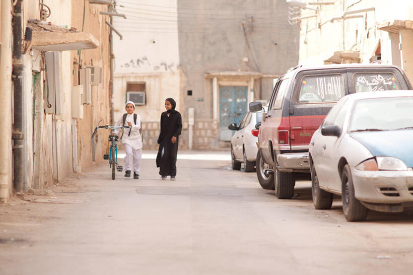 Abdullrahman Al Gohani as Abdullah and Waad Mohammed as Wadjda in "Wadjda."