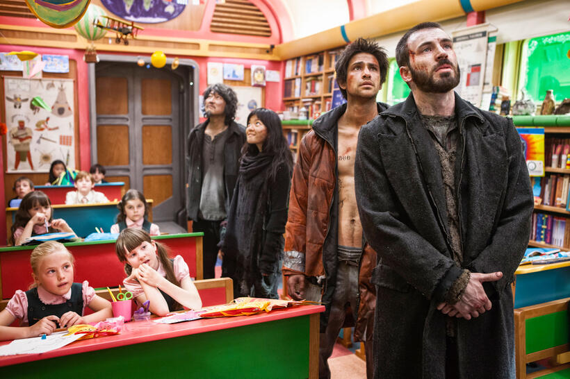 Song Kang-ho as Namgoong Minsu, Ah-sung Ko as Yona, Luke Pasqualino as Grey and Chris Evans as Curtis in "Snowpiercer."