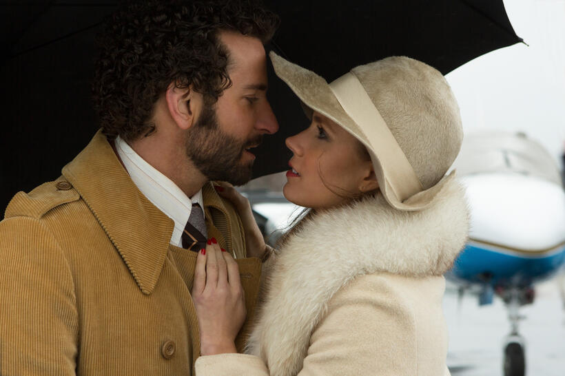Bradley Cooper as Richie Dimaso and Amy Adams as Sydney Prosser in "American Hustle."