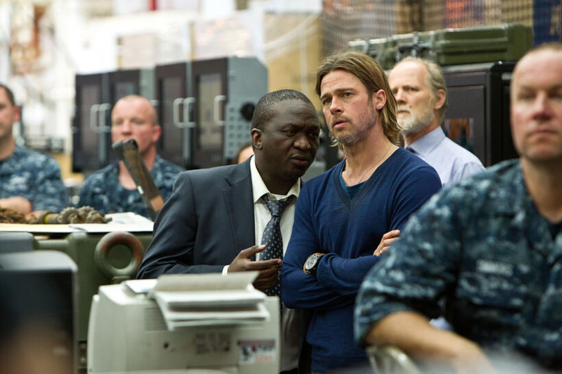 Fana Mokeona as Thierry Umutoni and Brad Pitt as Gerry Lane in "World War Z."