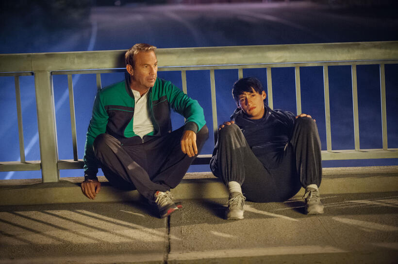 Kevin Costner as coach Jim White and Carlos Pratts as Thomas Valles in "McFarland, USA."