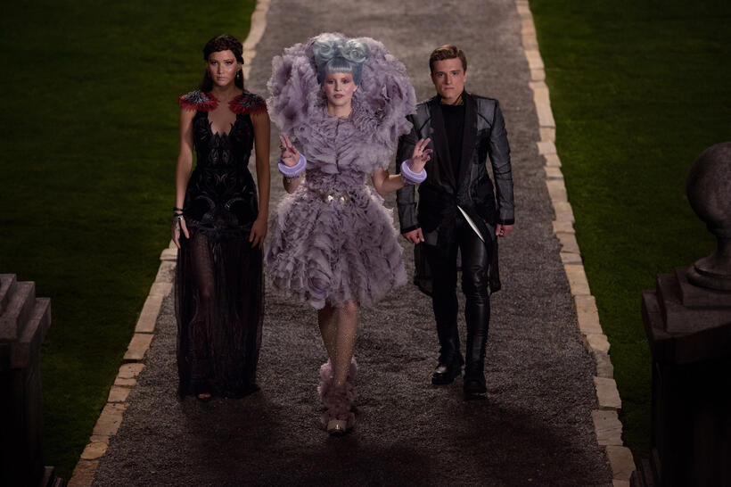 Jennifer Lawrence as Katniss Everdeen, Elizabeth Banks as Effie Trinket and Josh Hutcherson as Peeta Mellark in "The Hunger Games: Catching Fire."