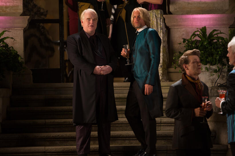 Philip Seymour Hoffman as Plutarch Heavensbee and Woody Harrelson as Haymitch Abernathy in "The Hunger Games: Catching Fire."