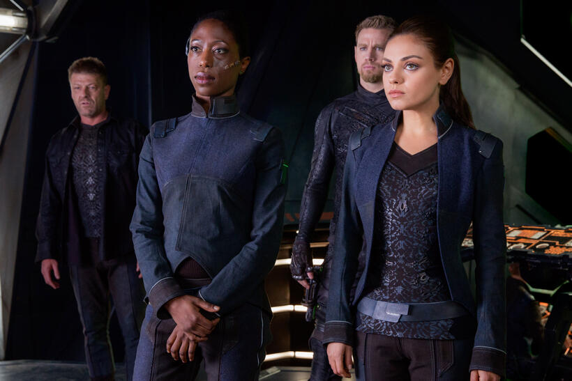 Sean Bean as Stinger Apini, Nikki Amuka-Bird as Diomika Tsing, Channing Tatum as Caine Wise and Mila Kunis as Jupiter Jones in "Jupiter Ascending."