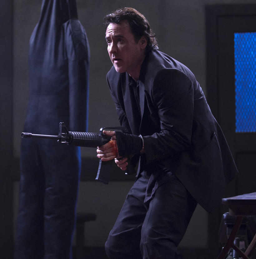 John Cusack as Jack in "The Bag Man."
