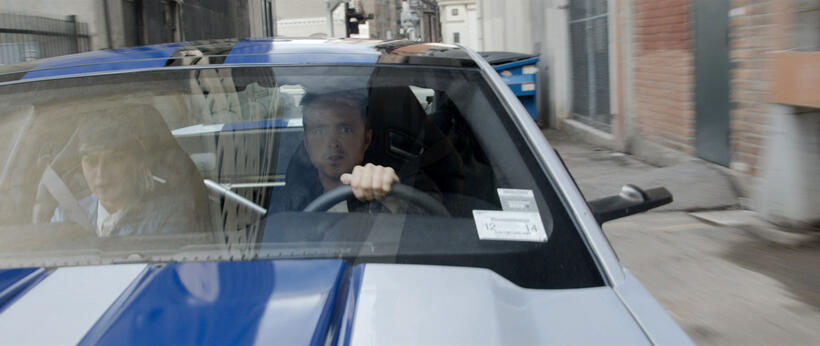 Imogen Poots as Julia Bonet and Aaron Paul as Tobey Marshall in "Need For Speed."