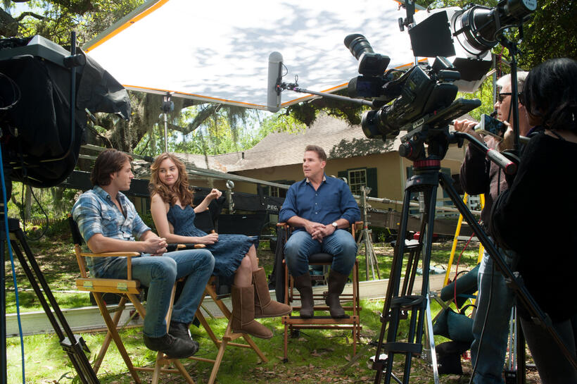 Luke Bracey, Liana Liberto and writer Nicholas Sparks on the set of "The Best of Me."