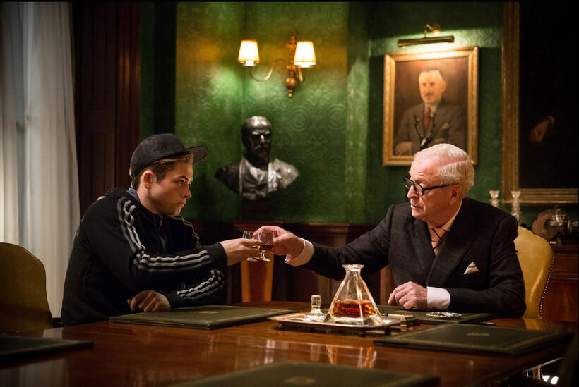 Taron Egerton as Eggsy and Michael Caine as Arthur in "Kingsman: The Secret Service."