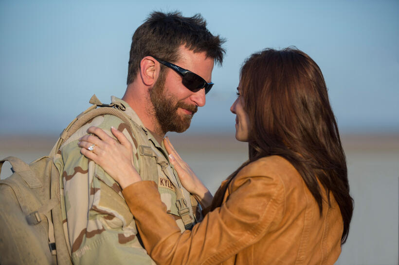 Bradley Cooper as Chris Kyle and Sienna Miller as Taya in "American Sniper."
