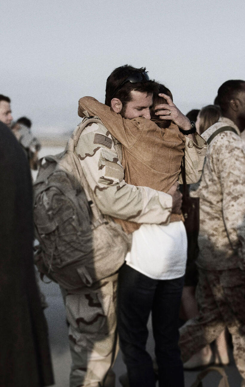Bradley Cooper as Chris Kyle and Sienna Miller as Taya in "American Sniper."