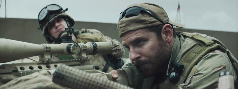Kyle Gallner as Goat-Winston and Bradley Cooper as Chris Kyle in "American Sniper."