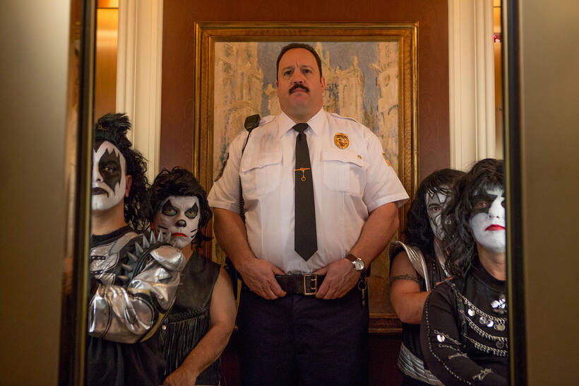 Kevin James as Paul Blart and Melissa Otero as Mini Kiss Dancer in "Paul Blart: Mall Cop 2."