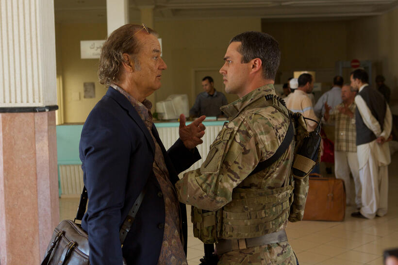 Bill Murray as Richie Lanz and Taylor Kinney as Private Barnes in "Rock The Kasbah."