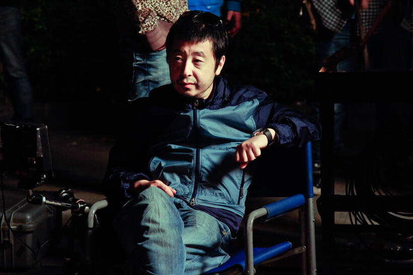 Director Jia Zhangke on the set of "Mountains May Depart."
