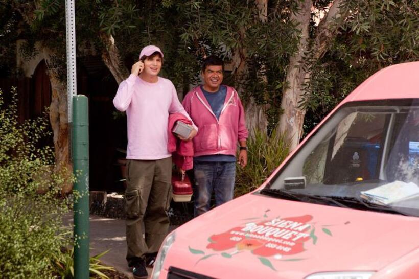Ashton Kutcher as Reed Bennett and George Lopez as Alphonso in "Valentine's Day."