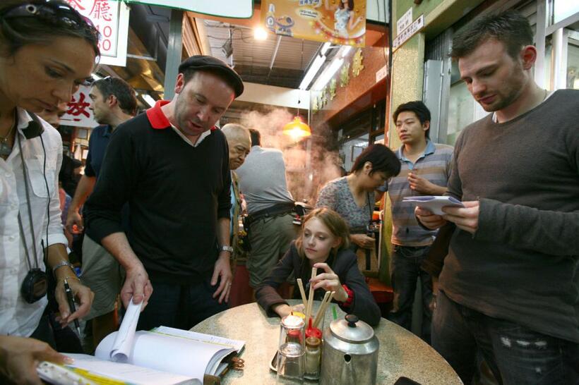 Director Paul Mcguigan, Dakota Fanning and Chris Evans on the set of "Push."