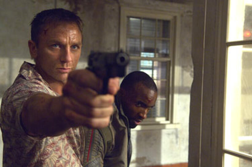 Bond (Daniel Craig) takes Mollaka (Sebastien Foucan) as a hostage in "Casino Royale."