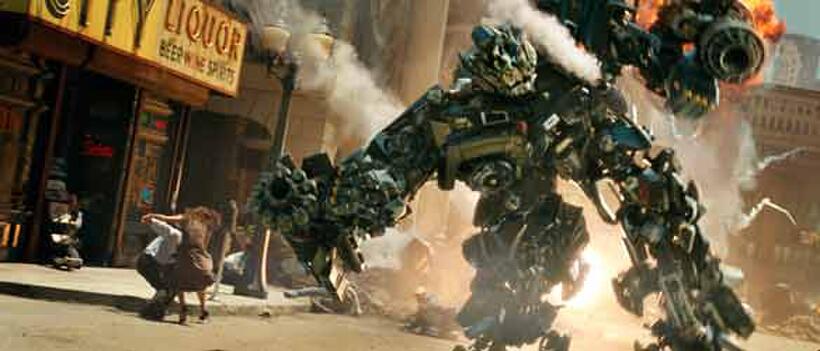 An Autobot, Ironhide, does battle with the destructive Decepticons in "Transformers."