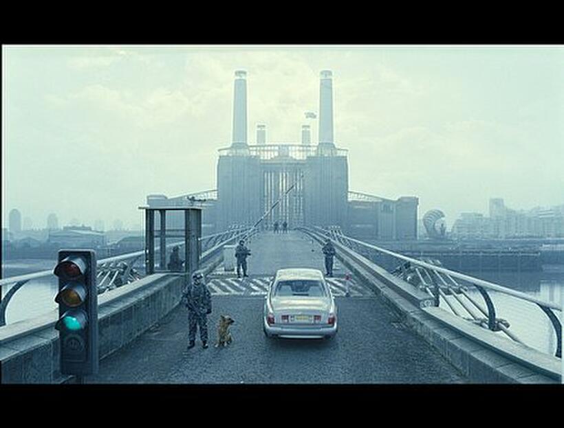 Theo (Clive Owen) crosses the bridge to visit his old friend in the ministry in "Children of Men."