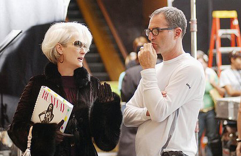Meryl Streep reviews a scene with director David Frankel on the set of "The Devil Wears Prada."