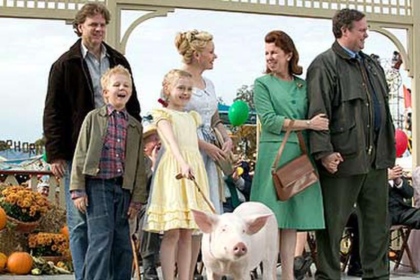 Louis Corbett (front, left) as Avery and Dakota Fanning (front, left center) as Fern. Behind them, Kevin Anderson (back, left) as Mr. Arable, Essie Davis (back, center left) as Mrs. Arable, Siobhan Fallon Hogan (back, center right) as Mrs. Zuckerman and Gary Basaraba (back, right) as Homer Zuckerman in "Charlotte's Web."