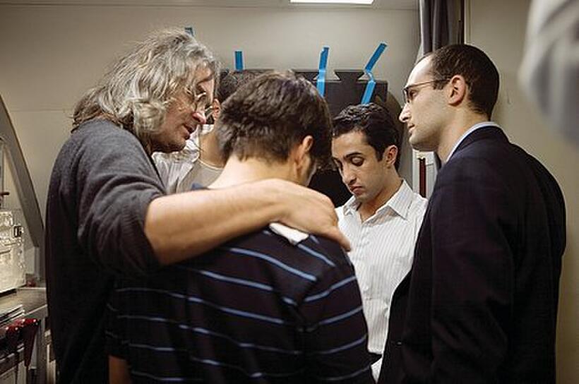 Writer/director/producer Paul Greengrass with the actors who portray the hijackers aboard United Airlines Flight 93. 