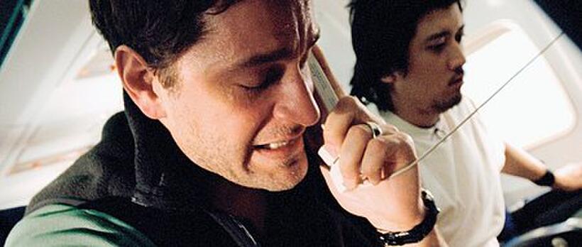 Peter Hermann as Jeremy Glick and Masato Kamo as Toshiya Kuge plan their next move against the hijackers in "United 93."