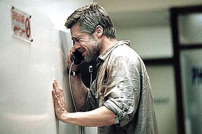 Richard (Brad Pitt) cries into the hospital phone as he speaks to his son in "Babel."