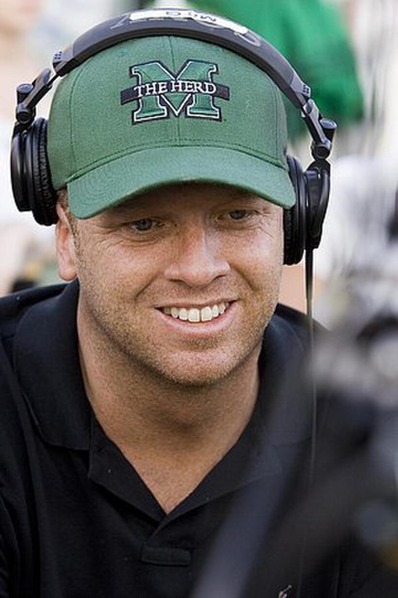Director McG reacts to the playback on the monitor during the filming of "We Are Marshall."