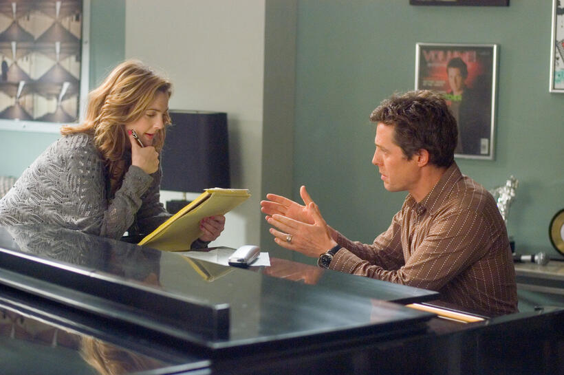 Sophie Fisher (Drew Barrymore) and Alex Fletcher (Hugh Grant) attempt to write a hit single for Cora Corman in "Music and Lyrics."
