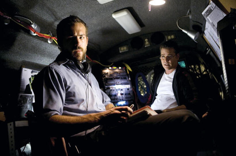 Agent Richard Messner (Ryan Reynolds) and his partner, Agent Donald Carruthers (Ray Liotta), hold surveillance in "Smokin' Aces."