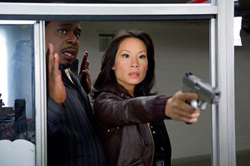 Cedric the Entertainer and Lucy Liu in "Code Name: The Cleaner."