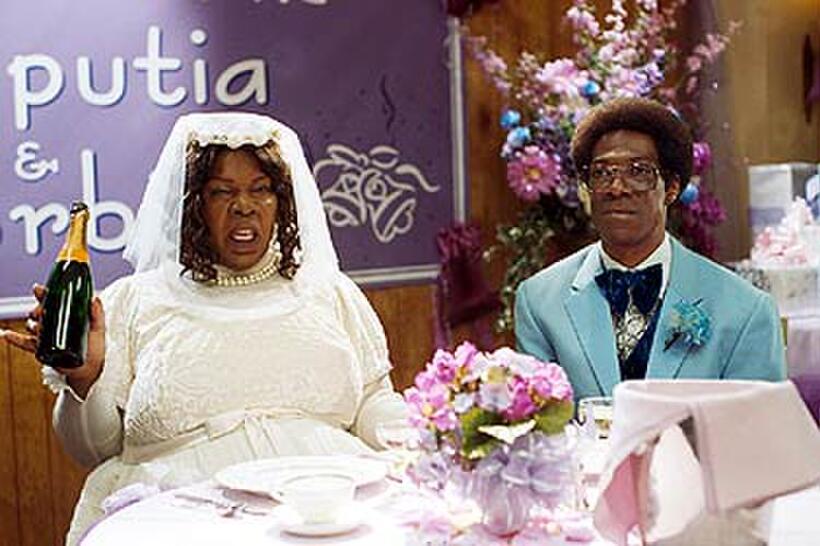 Rasputia and a miserable Norbit (both Eddie Murphy) in "Norbit."