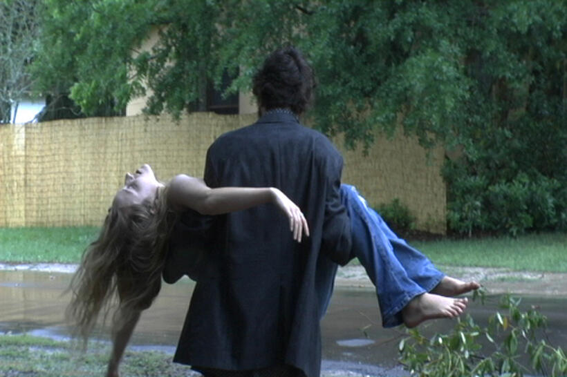 Scott (Damian Lahey) carries Mary (Kelly Forester) in "Cocaine Angel."
