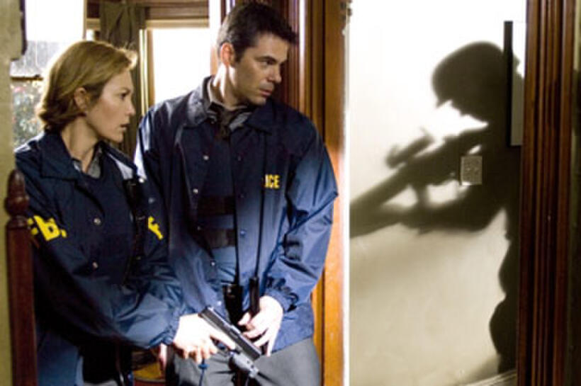 Diane Lane and Billy Burke in "Untraceable."