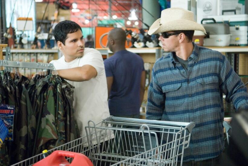 Michael Peña and Mark Wahlberg in "Shooter."