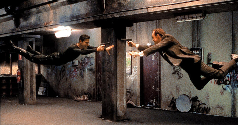 Keanu Reeves as Neo and Hugo Weaving as Agent Smith in The Matrix