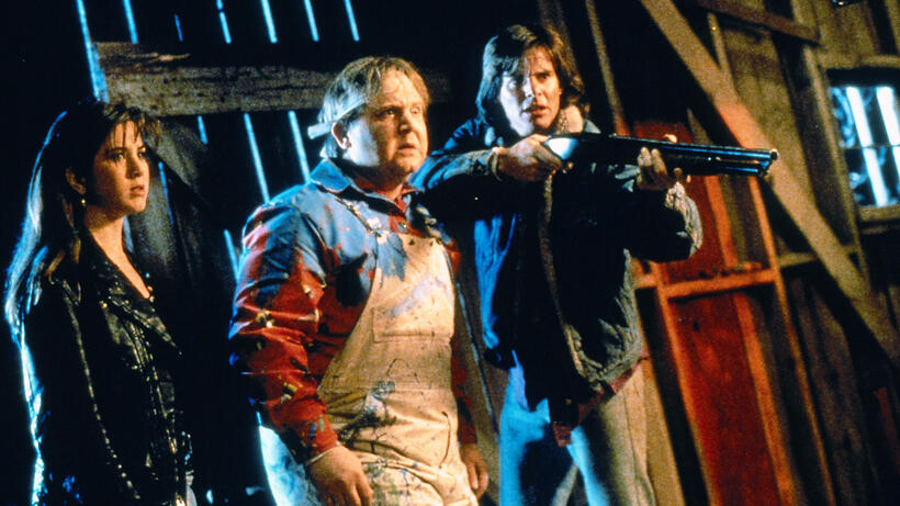 Jennifer Aniston and Warwick Davis in Leprechaun