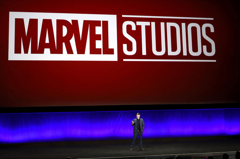 
	Kevin Feige in front of Marvel logo
