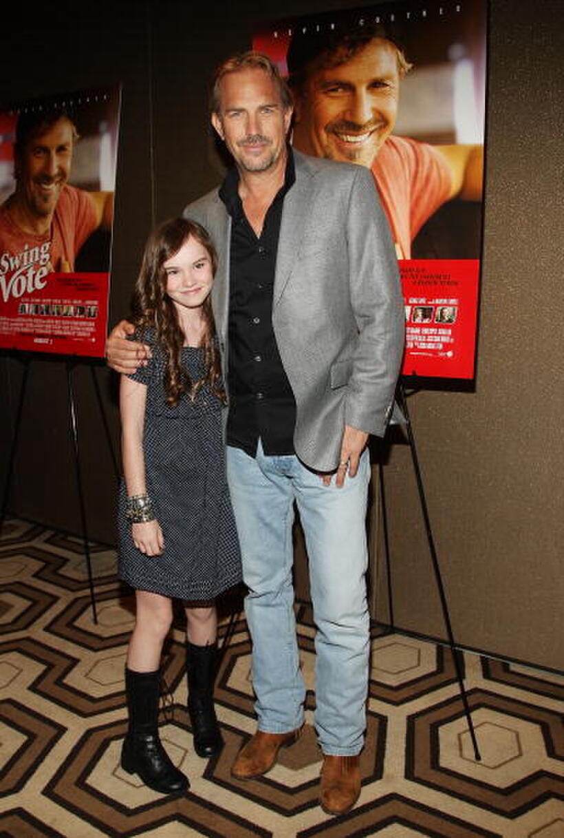 Madeline Carroll and Kevin Costner at the screening of "Swing Vote."