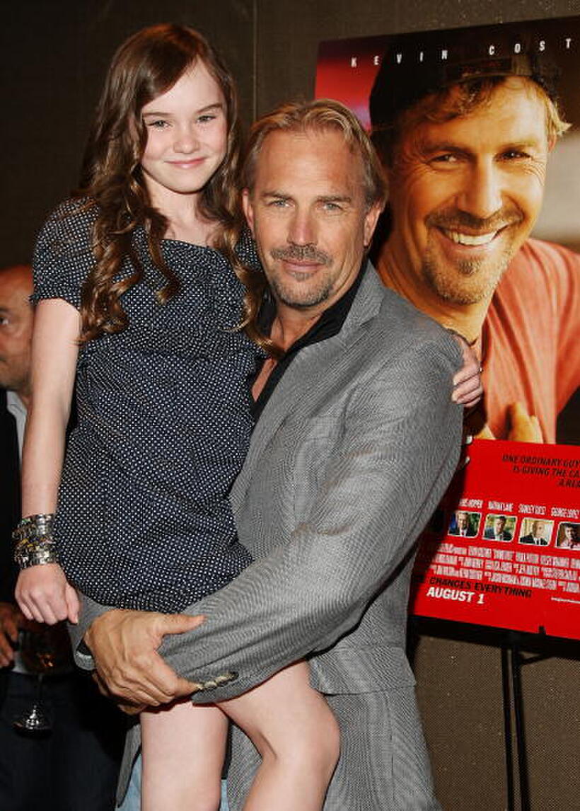 Madeline Carroll and Kevin Costner at the screening of "Swing Vote."