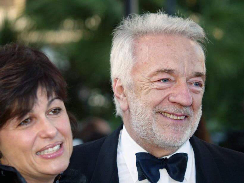 Jean-Pierre Cassel and his wife at the palais des festivals at the screening of "Cet amour-la" during the 56th Cannes film Festival.