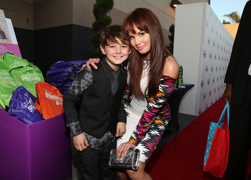 Max Charles and Guest at the Staples, DoSomething.org & Bella Thorne Party.