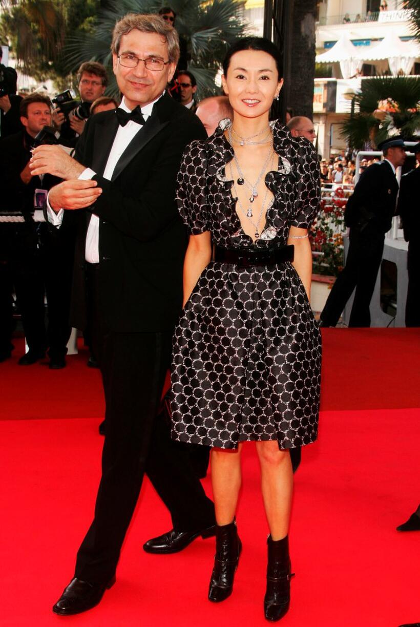 Maggie Cheung and Orhan Pamuk at the premiere of "No Country For Old Men" at the Palais des Festivals during the 60th International Cannes Film Festival.