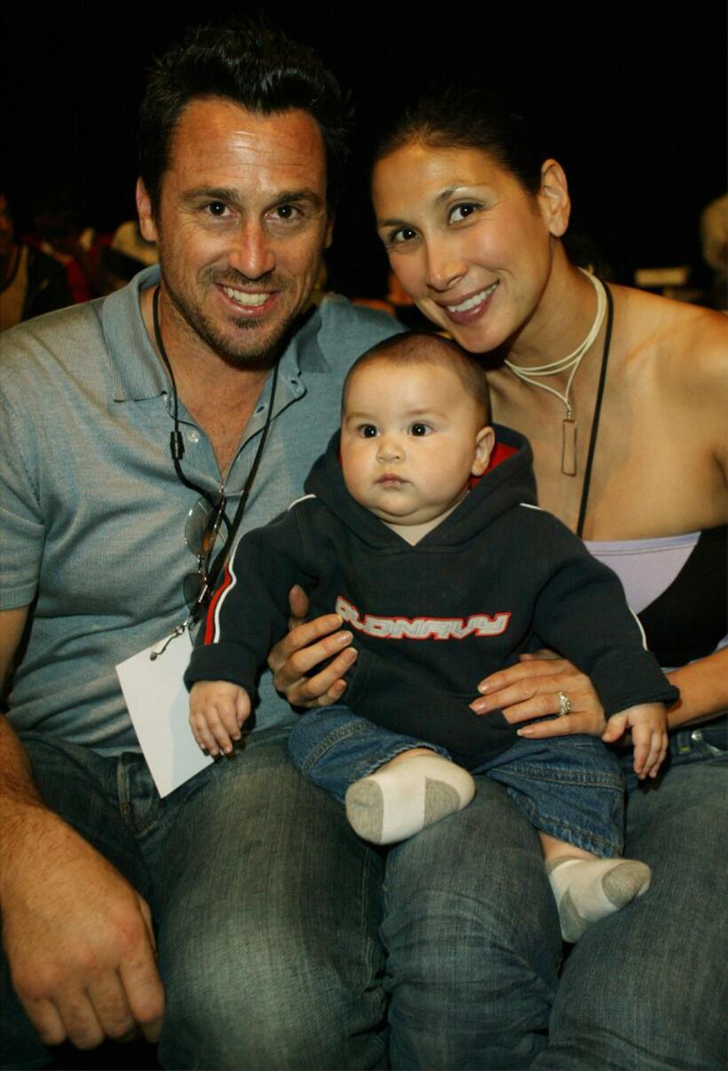 Craig DeCristo, baby Leo and Paris Chong at the Mercedes Benz Fashion Week.